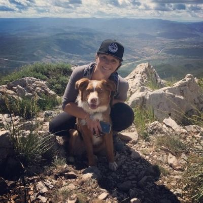 Woman with a dog on mountains